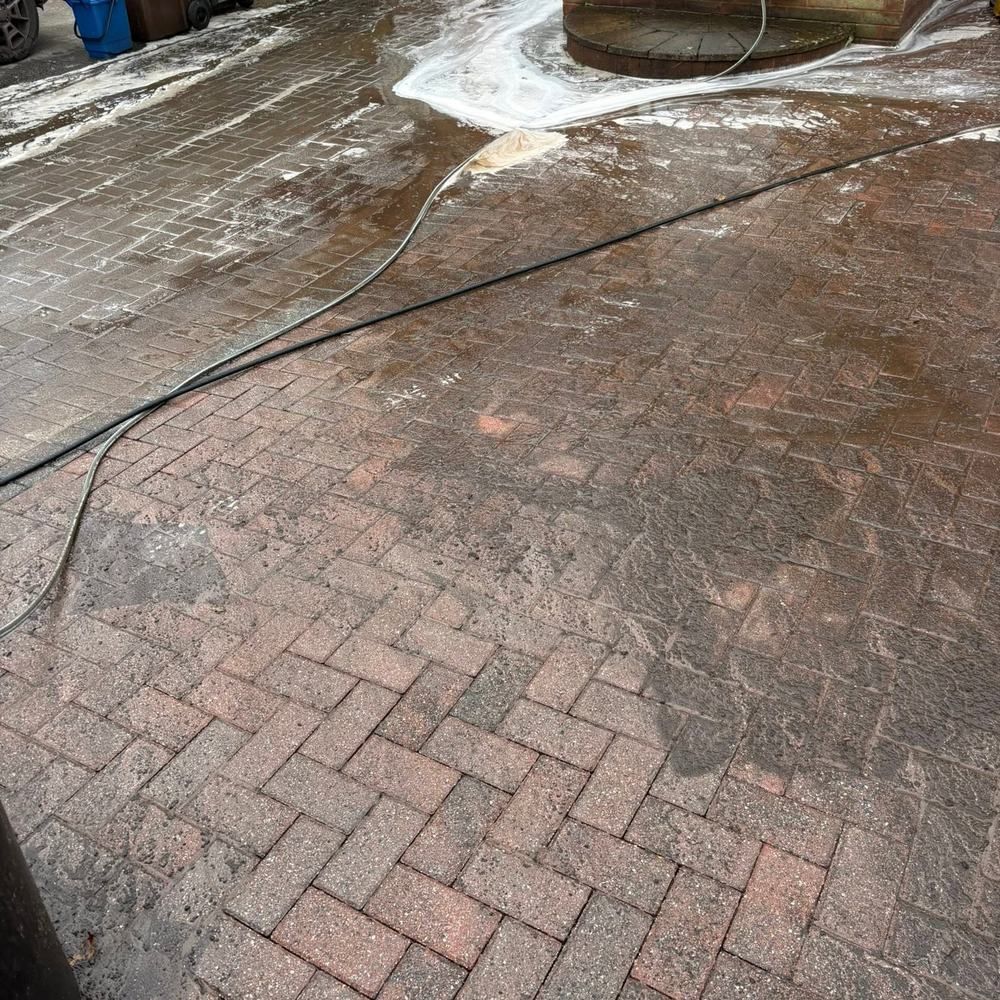 Herringbone block paving driveway before cleaning by Owens Exterior Cleaning, Devon