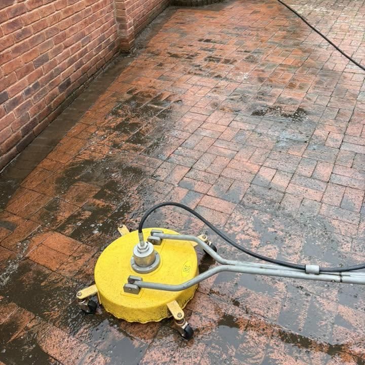 Brick paved courtyard driveway before cleaning by Owens Exterior Cleaning, Devon