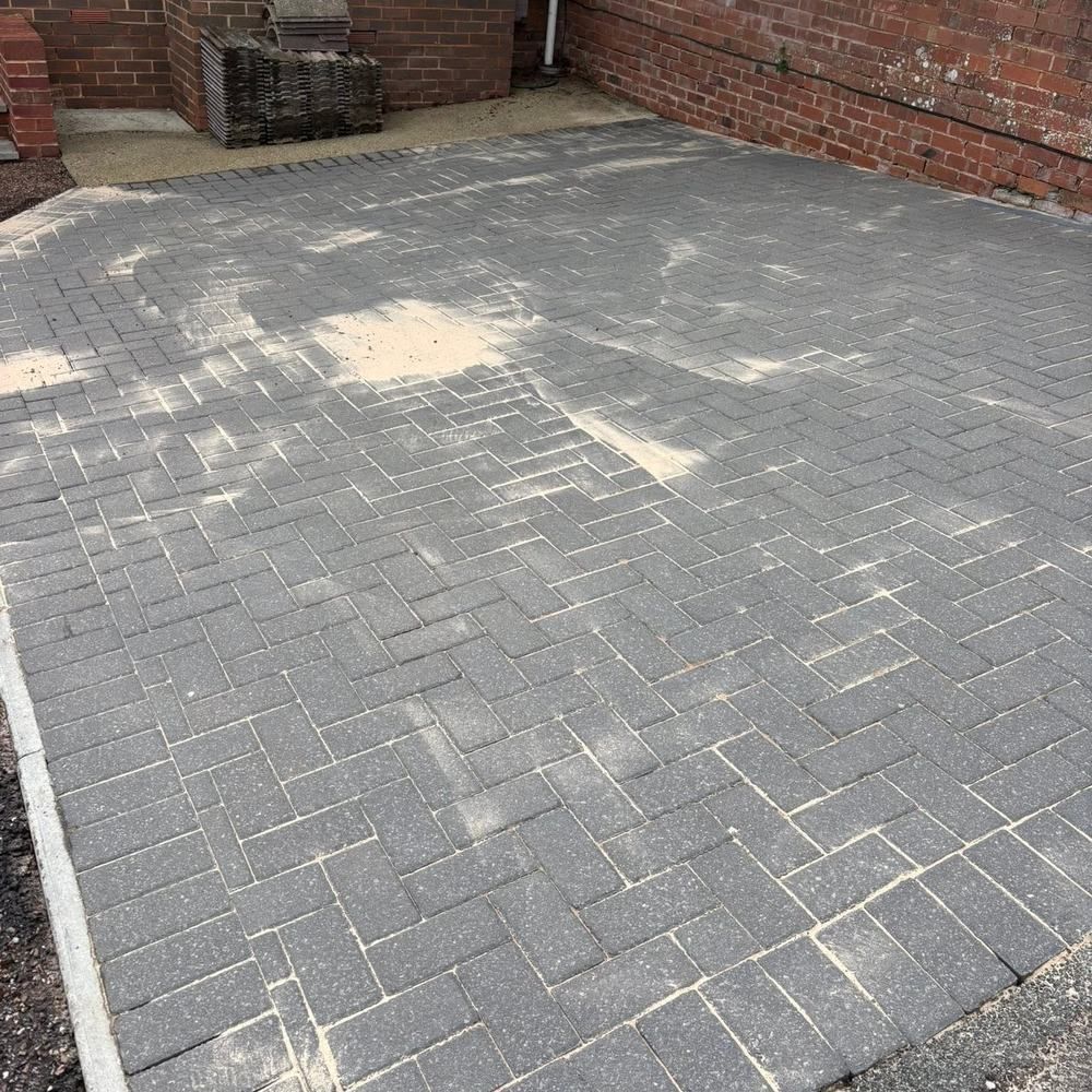 Charcoal block paving driveway before cleaning by Owens Exterior Cleaning, Devon