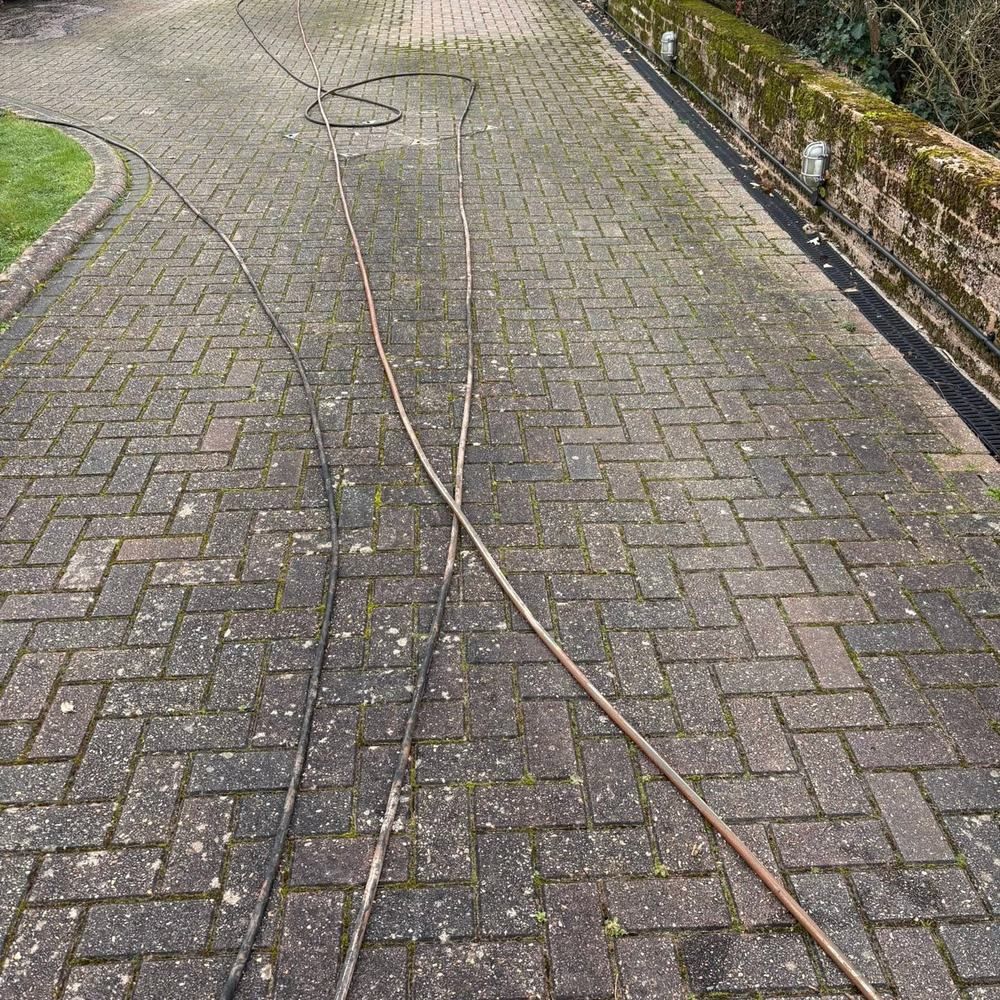 Long block paving driveway before cleaning by Owens Exterior Cleaning, Devon