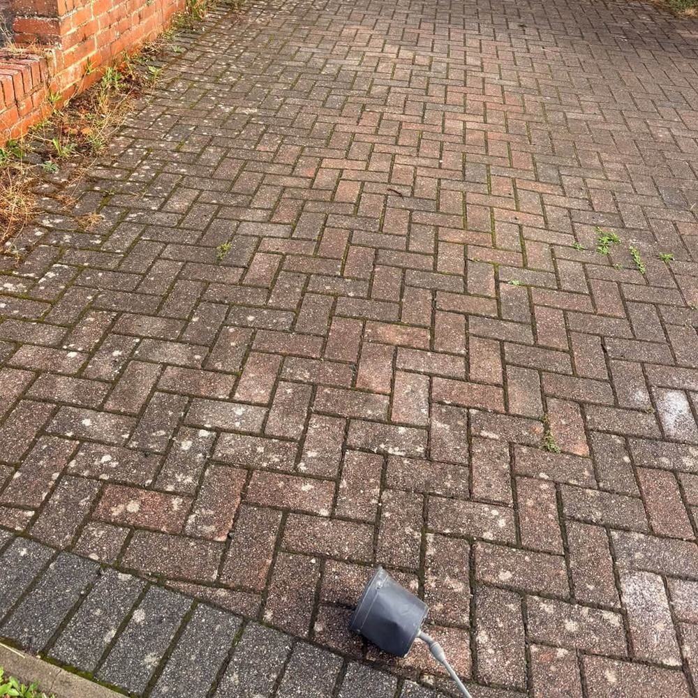Red block paving driveway before cleaning by Owens Exterior Cleaning, Devon (view 2)