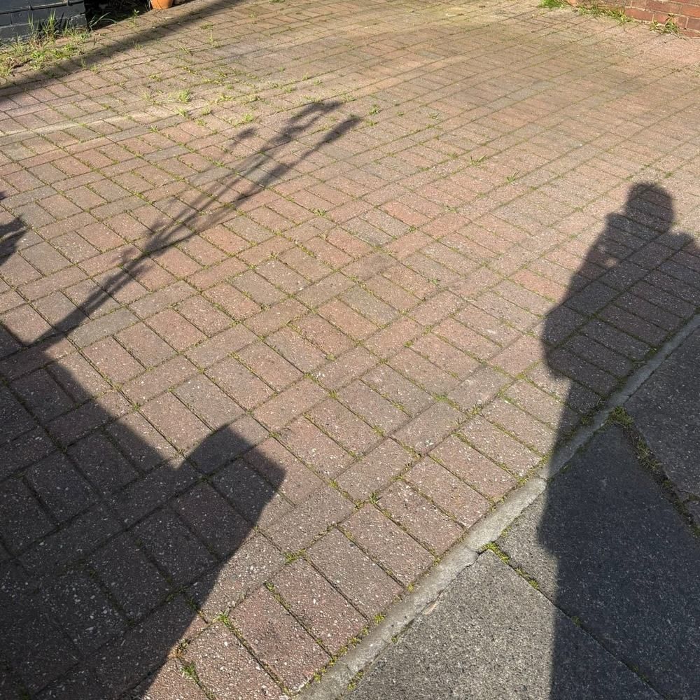 Red block paving front driveway before cleaning by Owens Exterior Cleaning, Devon
