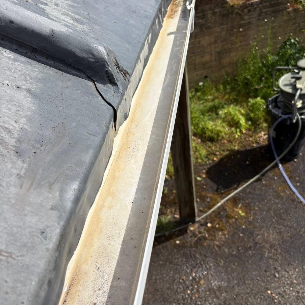 Blocked gutter and roof edge after cleaning by Owens Exterior Cleaning, Devon