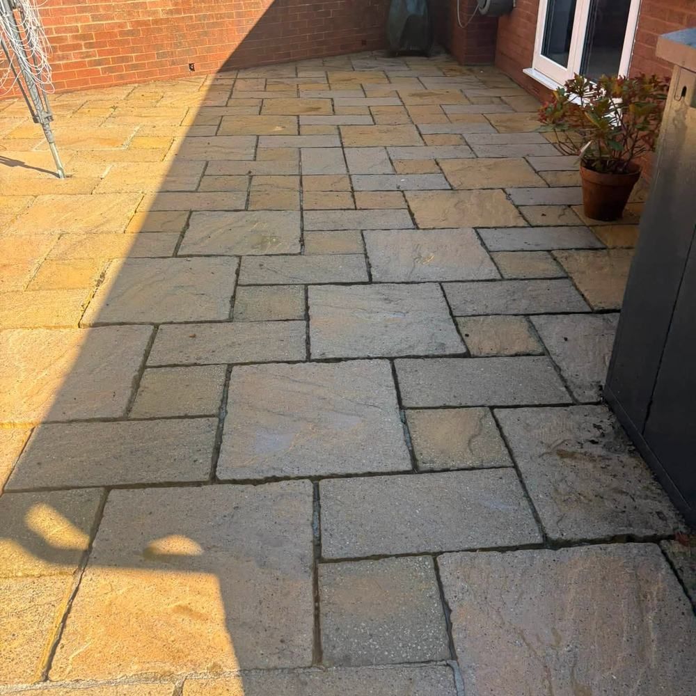 Buff sandstone patio after cleaning by Owens Exterior Cleaning, Devon