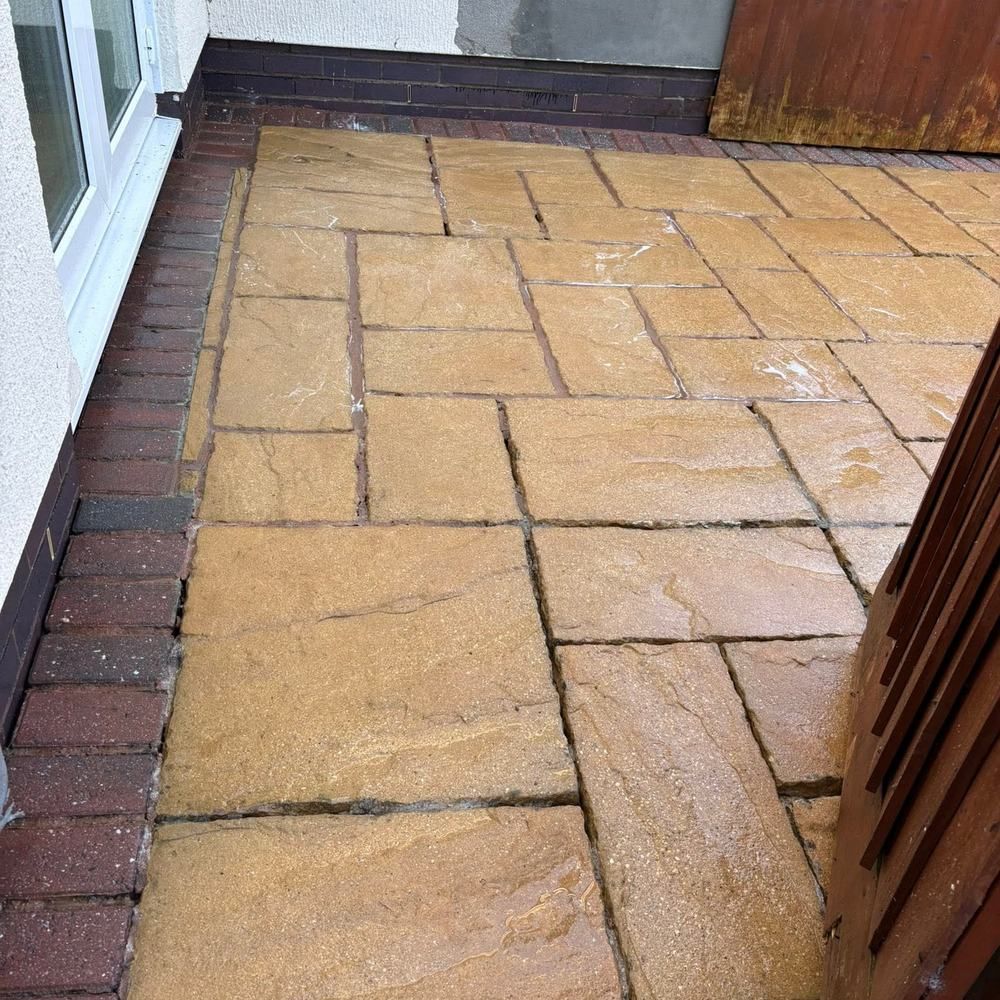 Curved sandstone patio after cleaning by Owens Exterior Cleaning, Devon