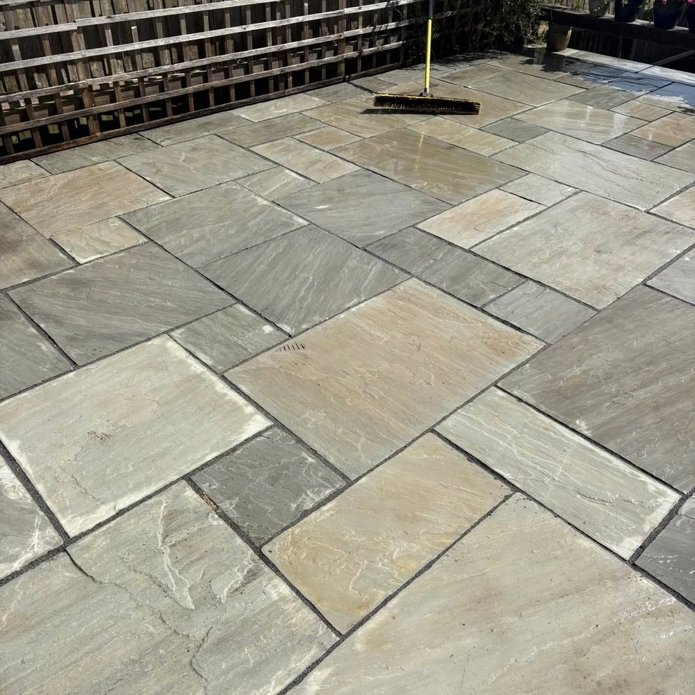 Grey sandstone patio after cleaning by Owens Exterior Cleaning, Devon