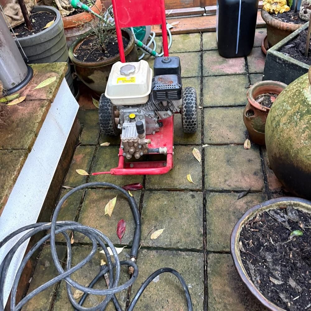 Quarry tile patio before cleaning by Owens Exterior Cleaning, Devon