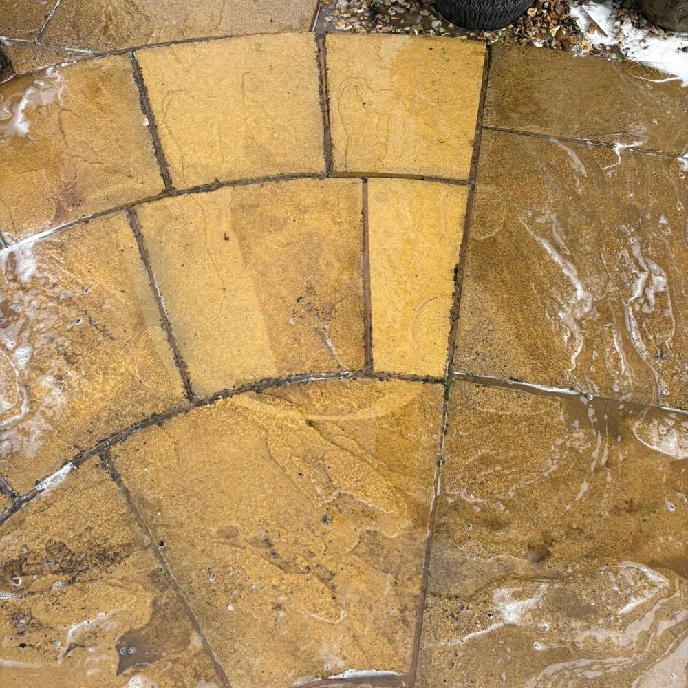 Sandstone circle patio after cleaning by Owens Exterior Cleaning, Devon