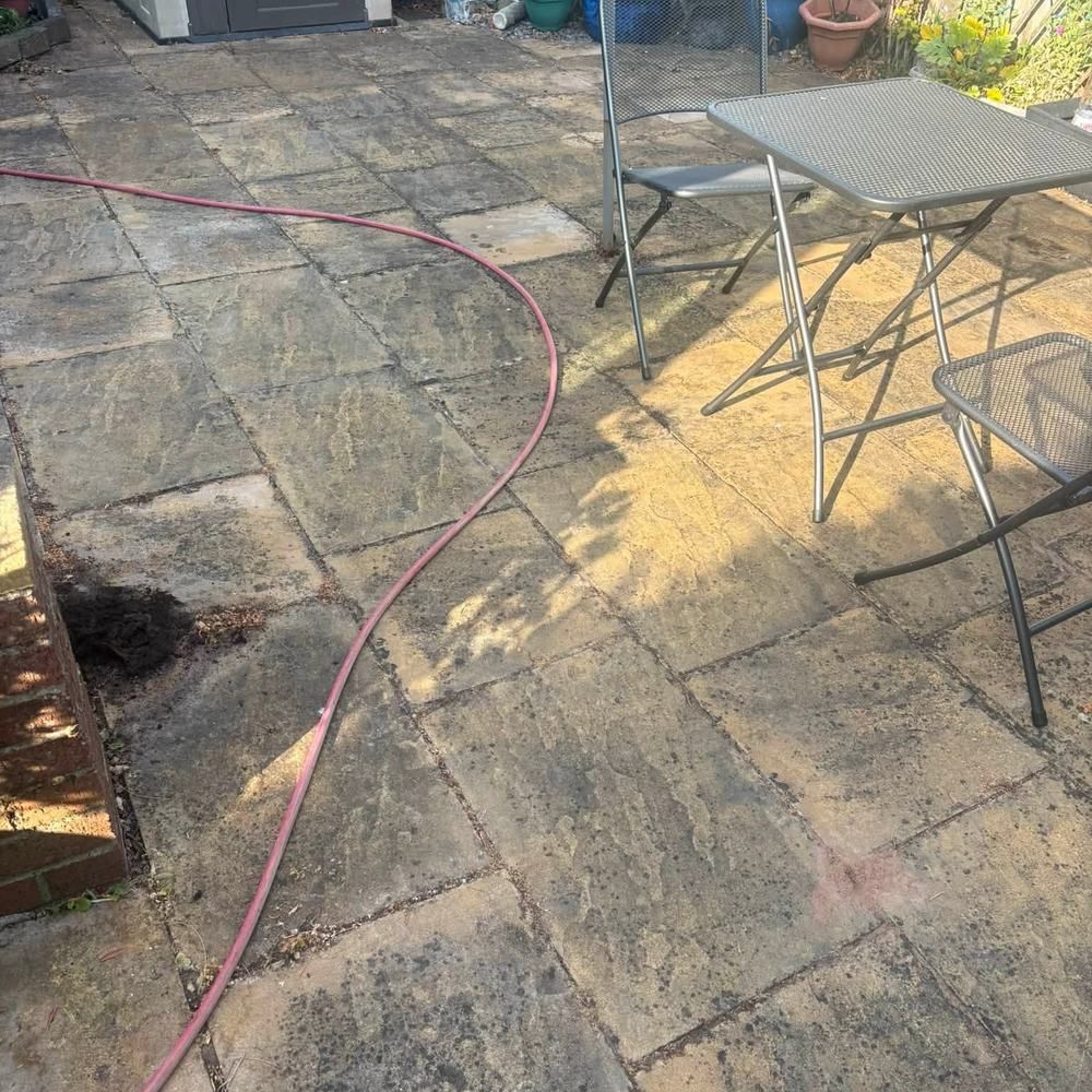 Sandstone garden patio before cleaning by Owens Exterior Cleaning, Devon