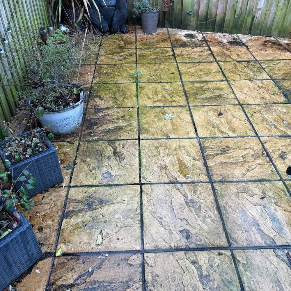 Sandstone patio before cleaning by Owens Exterior Cleaning, Devon