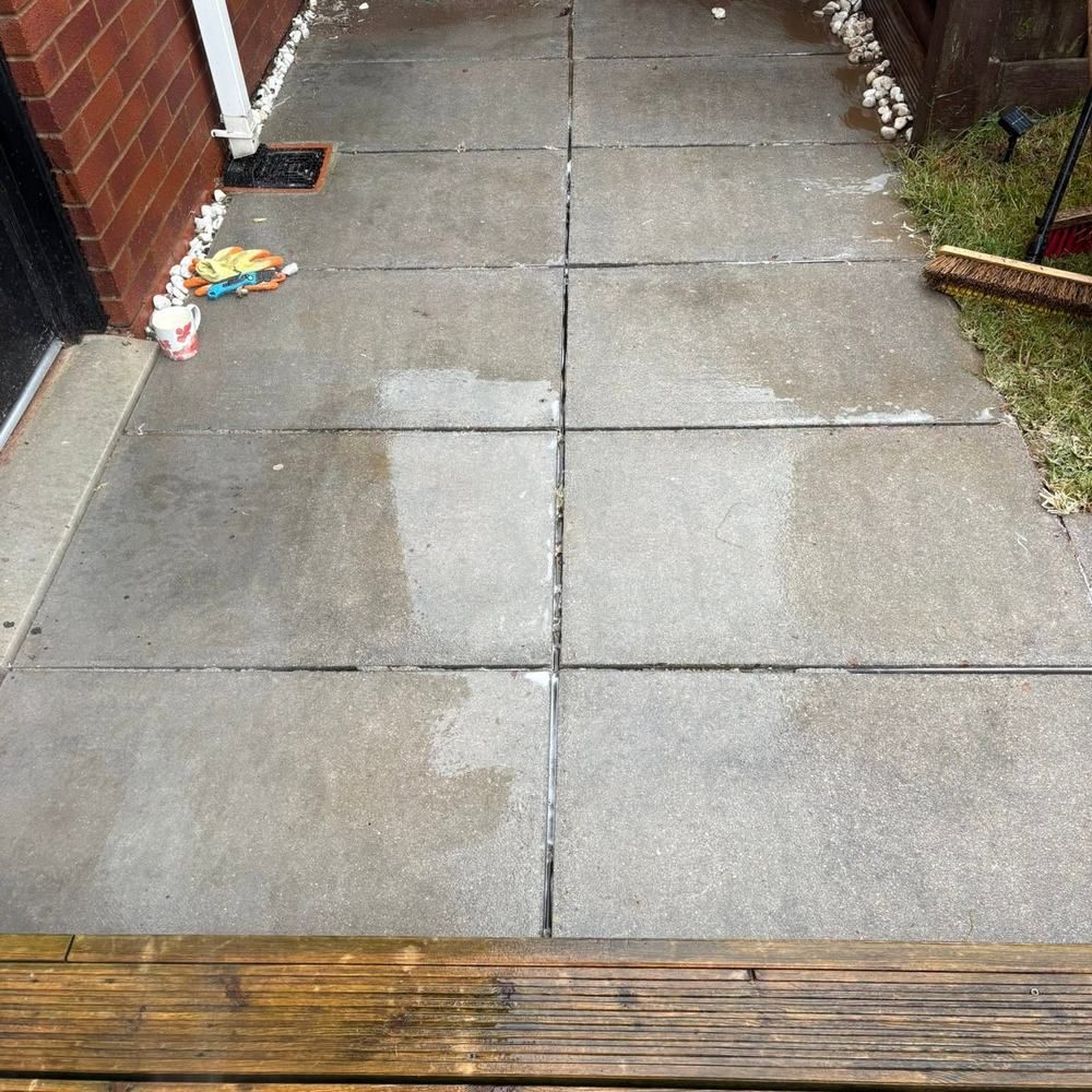 Concrete slab patio after cleaning by Owens Exterior Cleaning, Devon