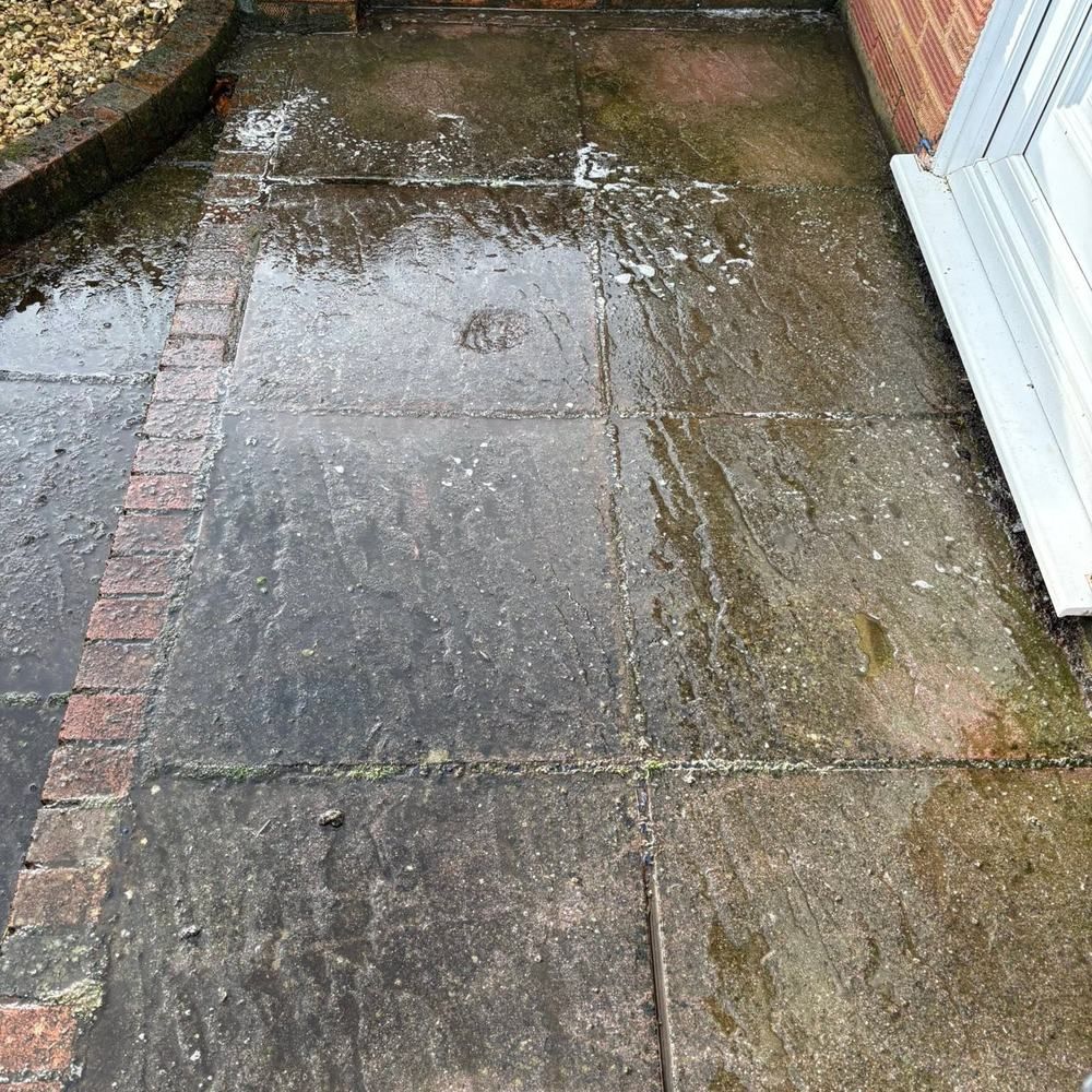 Slab patio before and after cleaning by Owens Exterior Cleaning, Devon