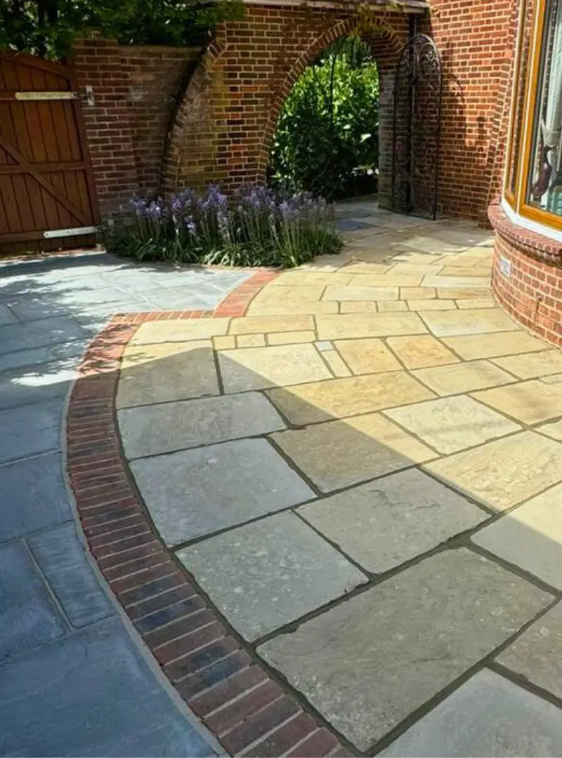 Curved sandstone garden path after cleaning