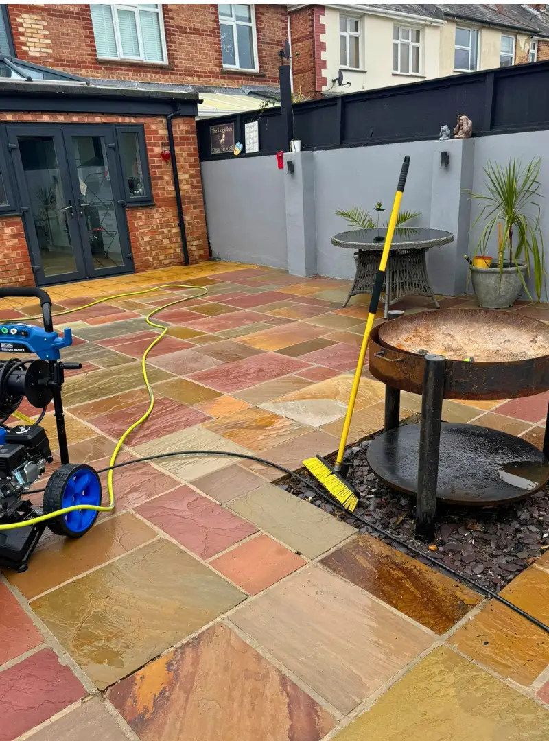 Sandstone patio with fire pit after cleaning